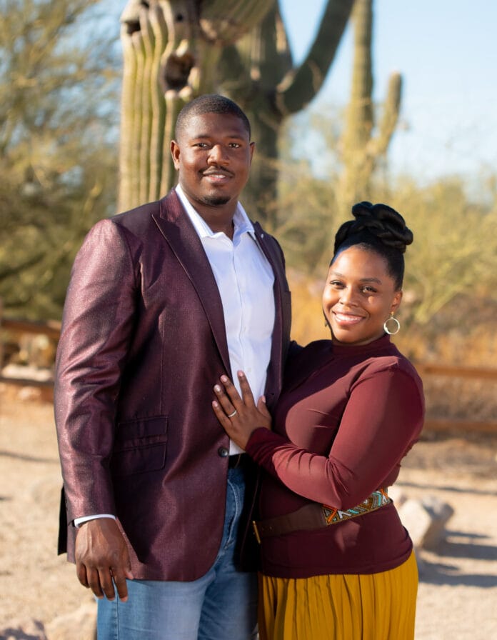 couple outside in front of cactus