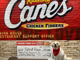 dog with Raising Canes check