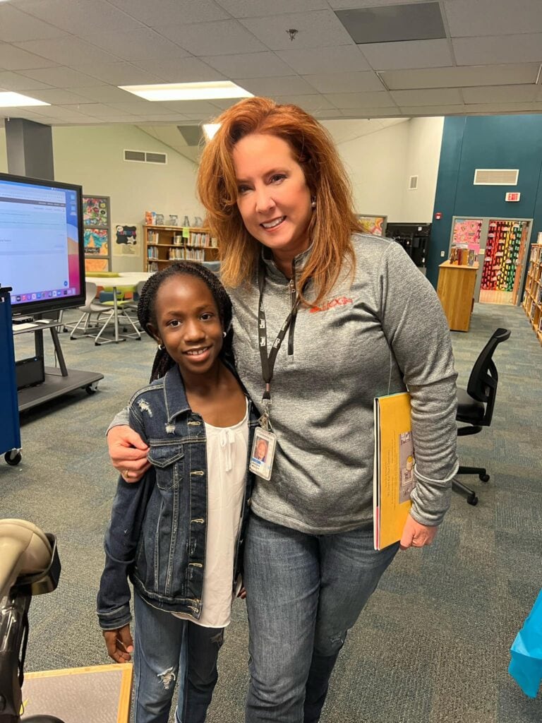 lady with child in a classroom