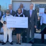 Bank Of America Donates $700k To Area Food Banks people holding cardboard check
