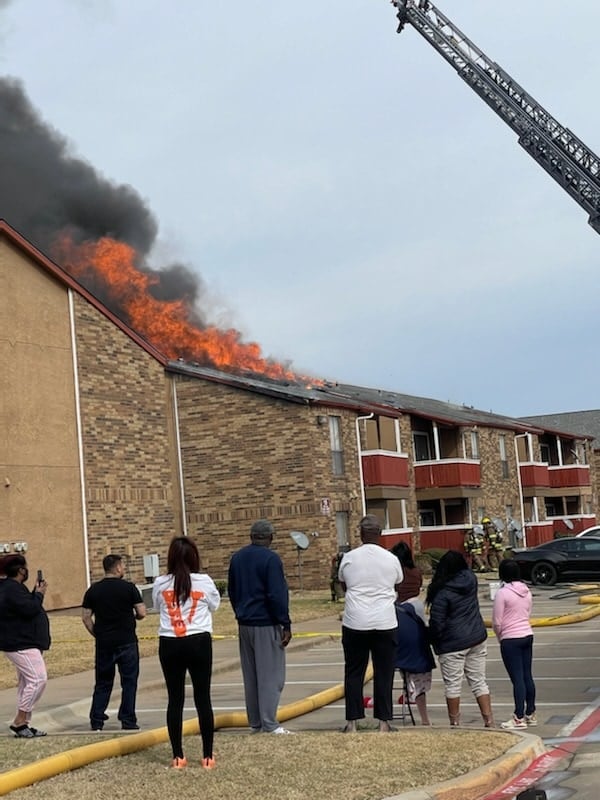 people watching apartment fire