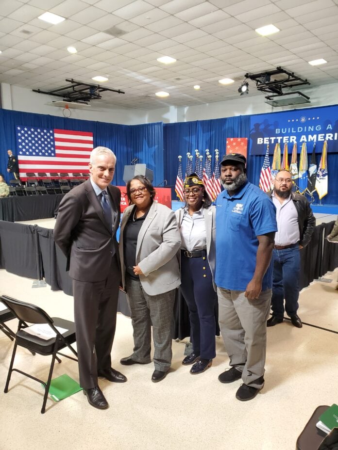 Secretary of Department of Veterans Affairs with others
