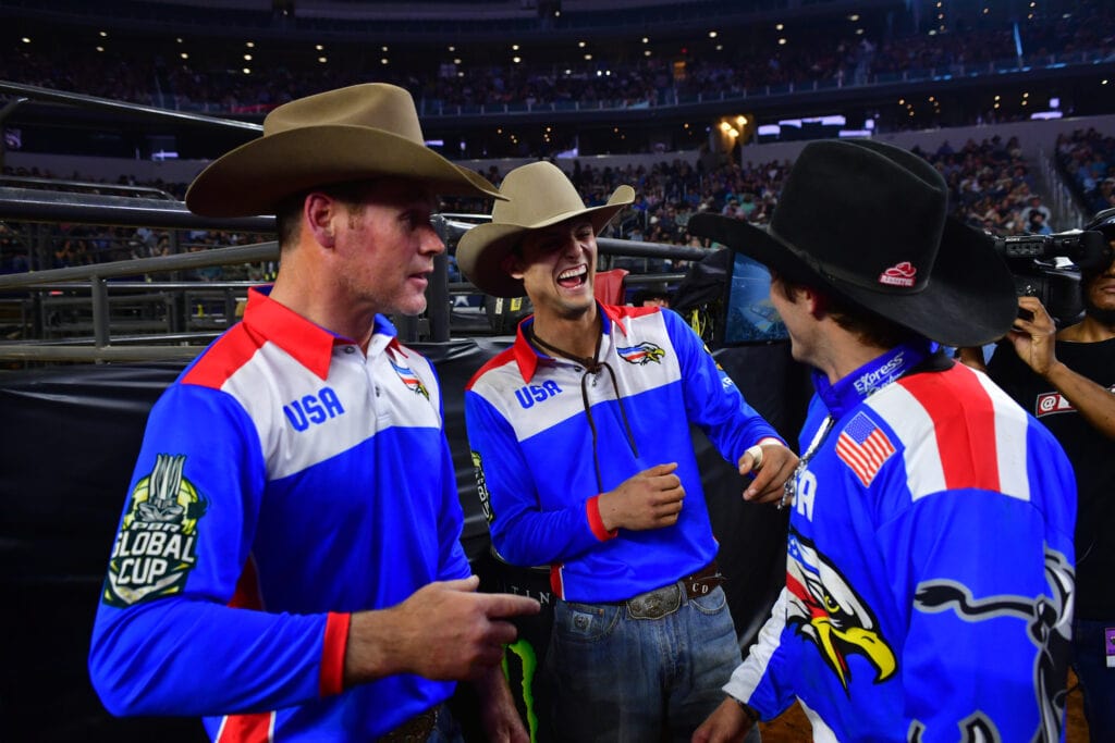 three cowboys laughing