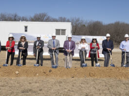 people with hard hats and shovels