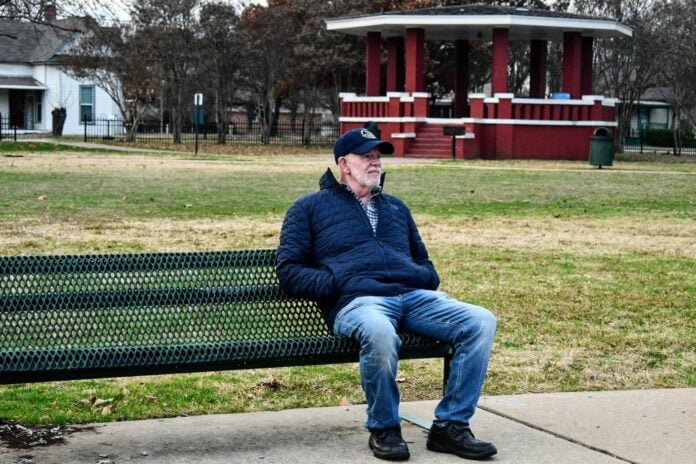 man sitting on park bench