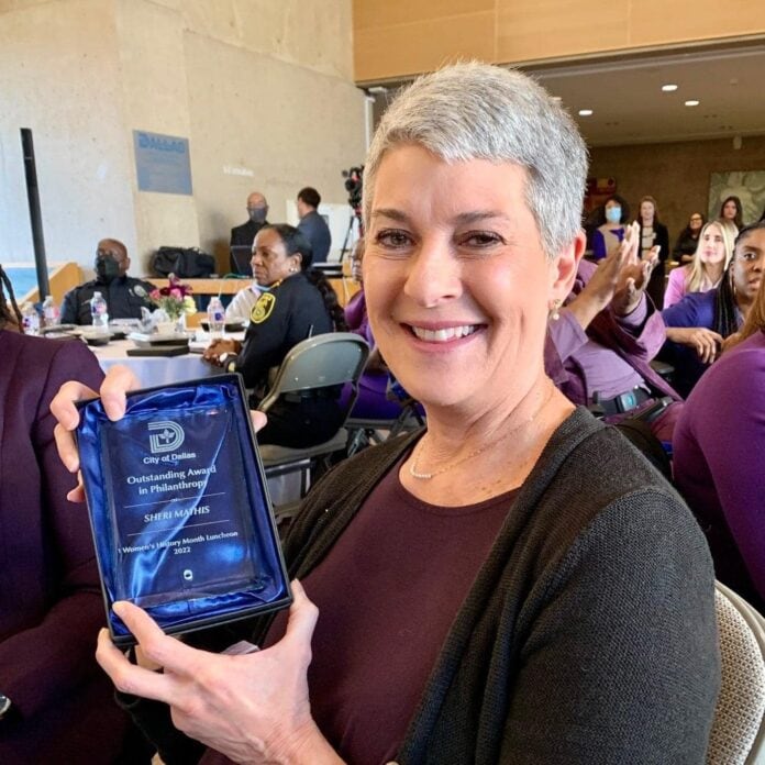 Sheri Mathis with award