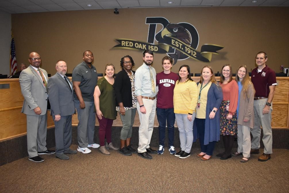 Red Oak staff pose with senior