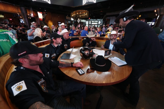 cowboys sitting around a table