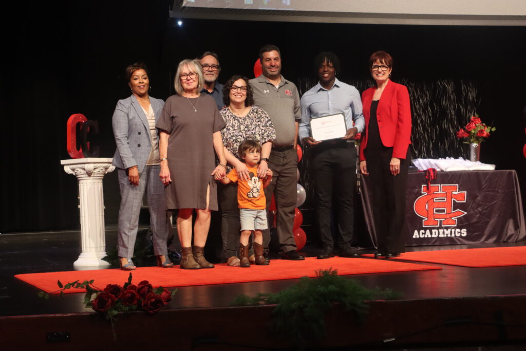 Channing Vernon scholarship recipient with check