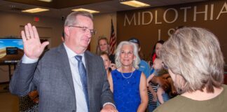 Midlothian ISD Selects New Officers, Updates Dress Code Mike Dillow taking oath