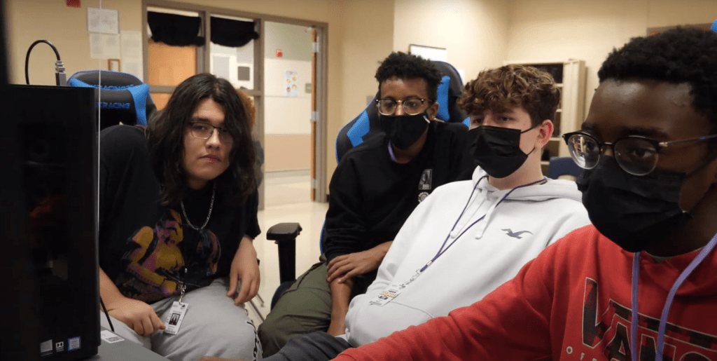 kids wearing masks around computer