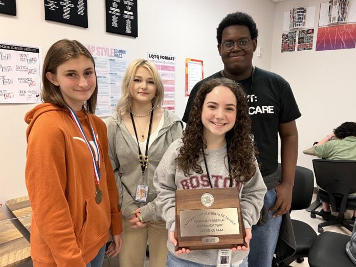 students holding awards