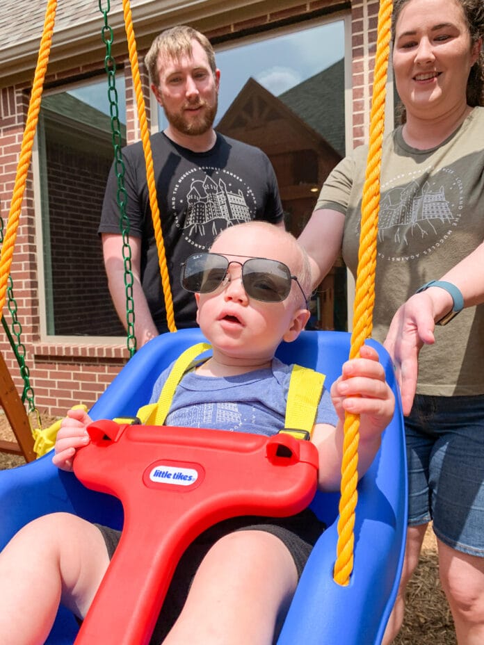 two year old in play swing