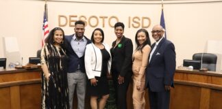 DeSoto ISD School Board Approves Three Leadership Positions ladies and gentleman standing in front of DeSoto ISD letters