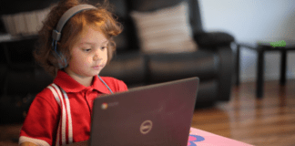 Harmony Public Schools Offering Virtual Option For K-12 kid with laptop