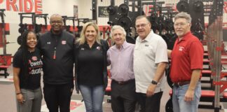 Texas High School Coaches Association Presents Cedar Hill Athletics With New Weight Room Cedar Hill ISD Coaches in weight room