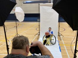 kid in wheelchair being photographed
