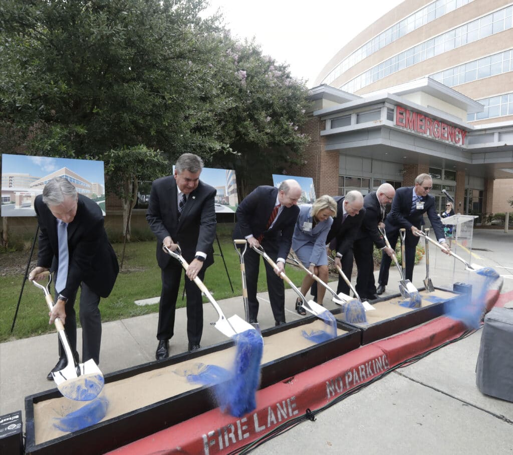 people with shovels for groundbreaking ceremony