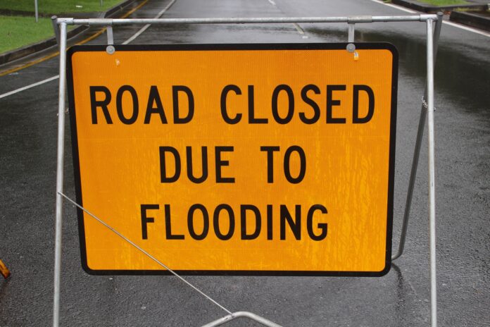 road closed due to flooding sign
