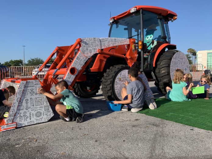 Kubota tractor with kids playing