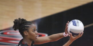 Jamia Johnson, Junior Outside Hitter Leads Cedar Hill Volleyball To New Heights Jamia Johnson serving volleyball