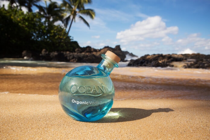 ocean vodka bottle on beach