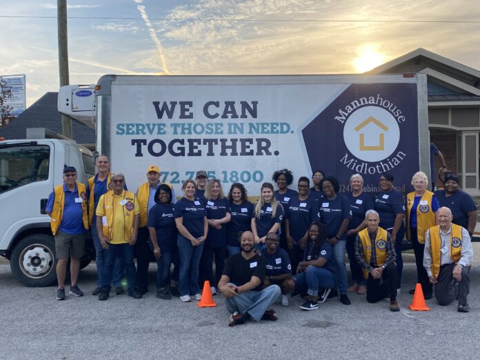 Group of people in front of box truck