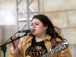 Jade Flores singing with guitar