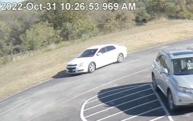 white chevrolet in parking lot