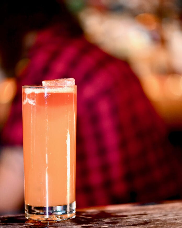 pink drink in highball glass