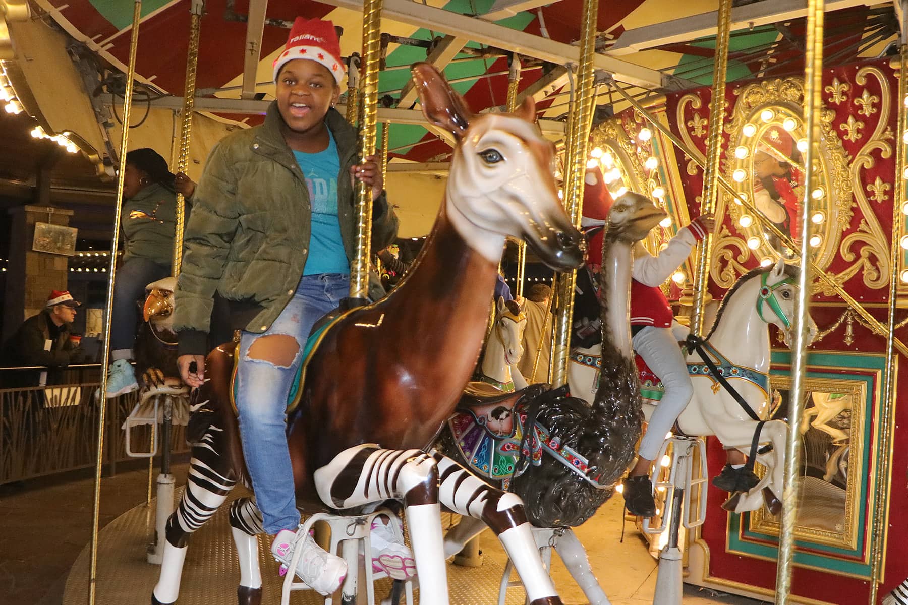 kid on carousel