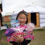 Operation Christmas Child Drop Off Sites In DeSoto Now Open child holding presents