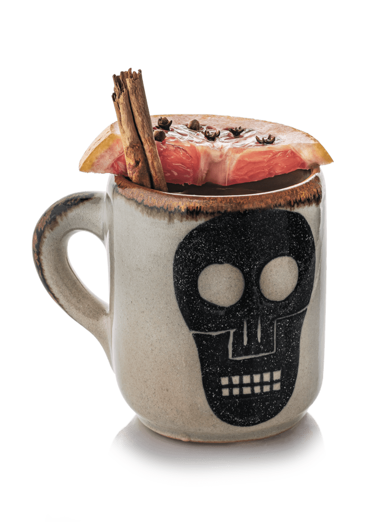 skull mug with grapefruit garnish