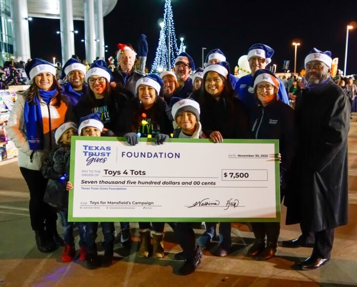 unnamed (18) Texas Trust employees with big check