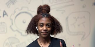 Folks Is Thankful for Early College Academy Opportunity student with fingers held like longhorn