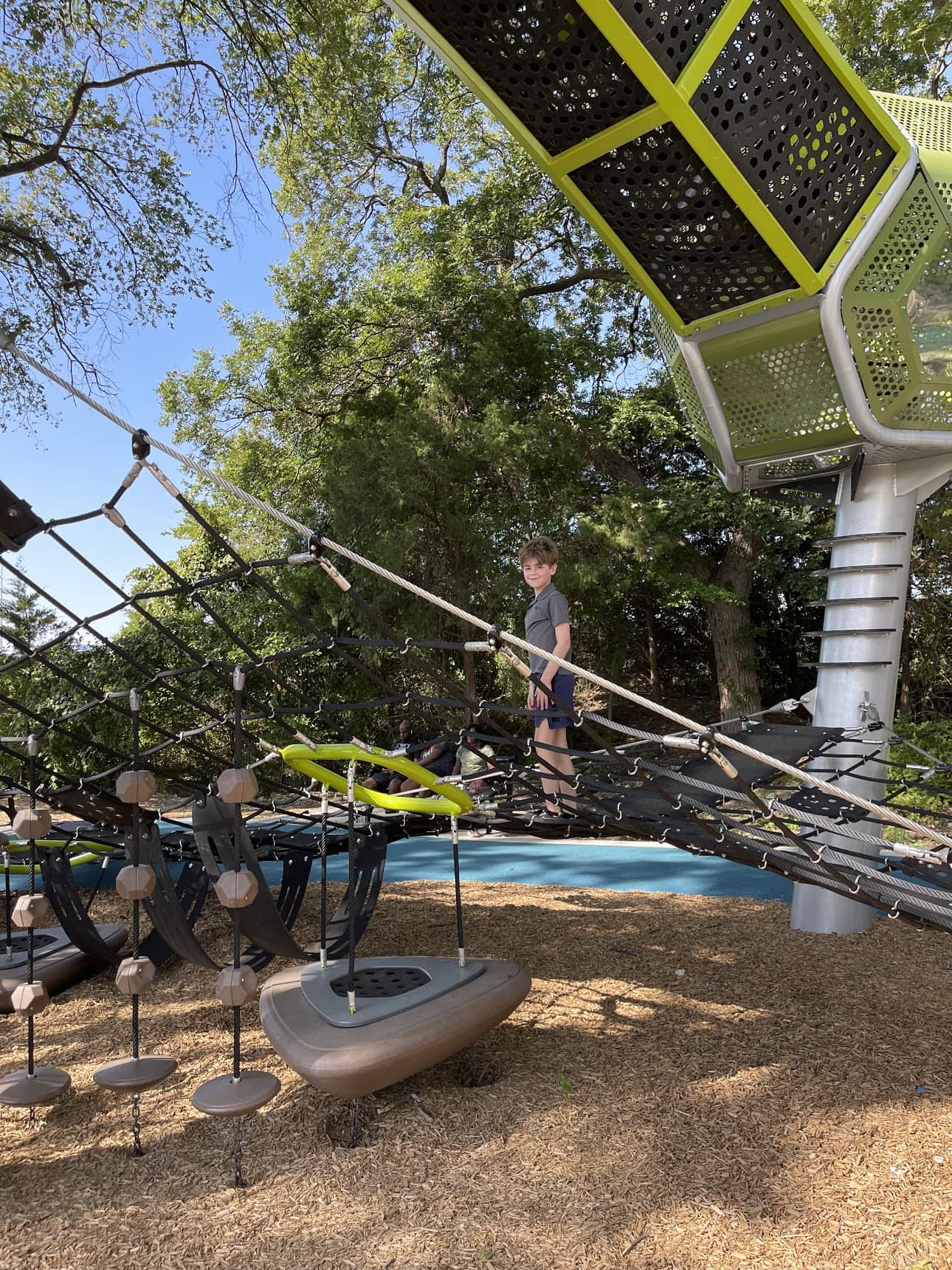 boy on playground equipment