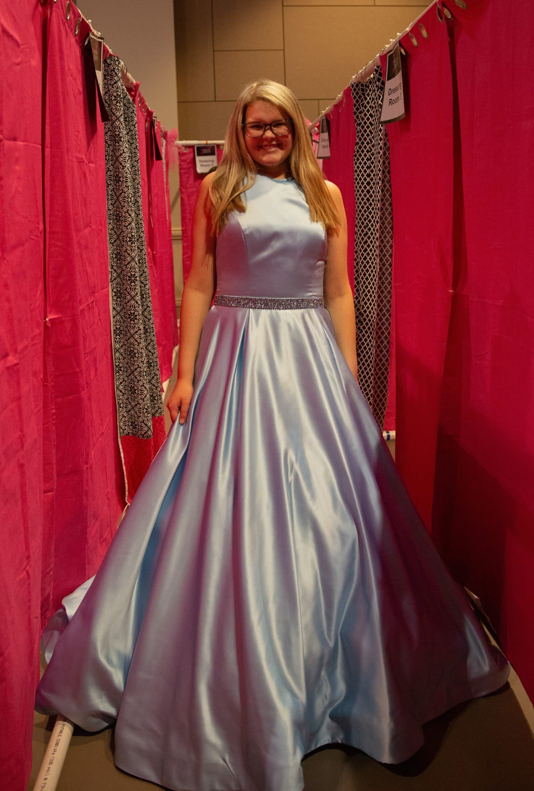 girl wearing blue prom dress