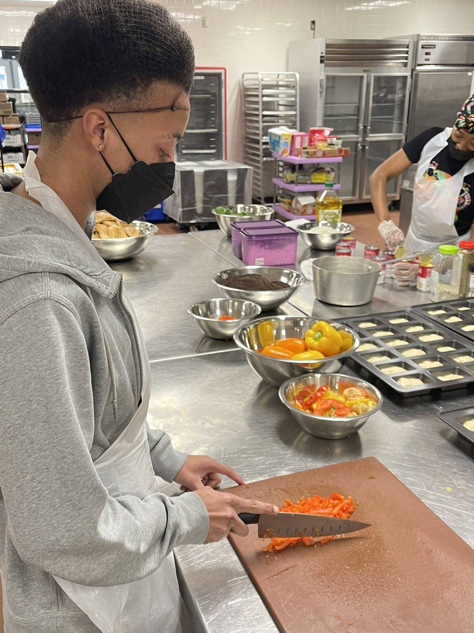 kid chopping vegetables