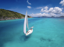 sailboat in aqua water