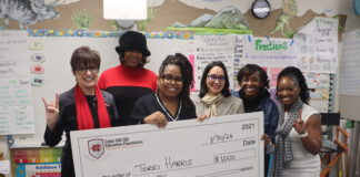 Harris, Salgado Earned Cedar Hill ISD Education Foundation Grants adults and students holding cardboard check