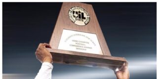 Eagles Soar as No. 1 in Preseason Rankings: Opponents Eye Inspiration from Mathis’ ‘Poster Board Material’ Coach holding a trophy