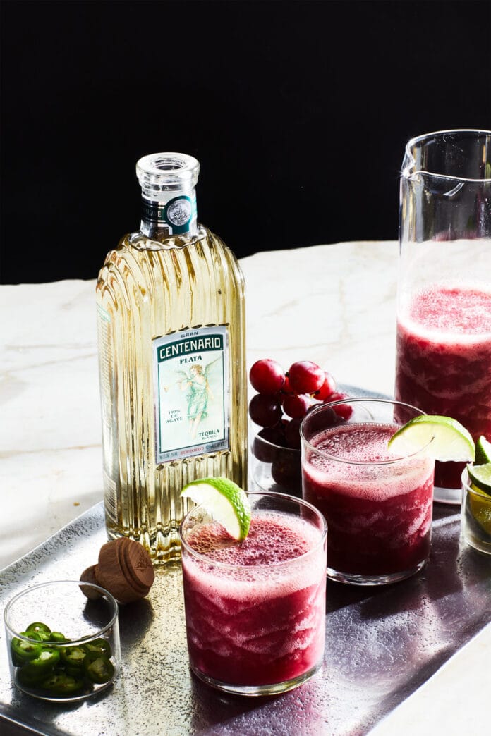 tequila bottle with watermelon margaritas
