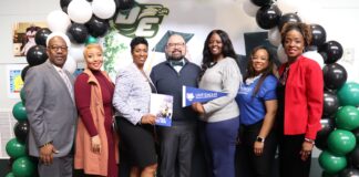 UNT Dallas Announces Automatic Admission to Every Class of 2023 Graduating Senior at DeSoto High School adults standing by green black ballooons