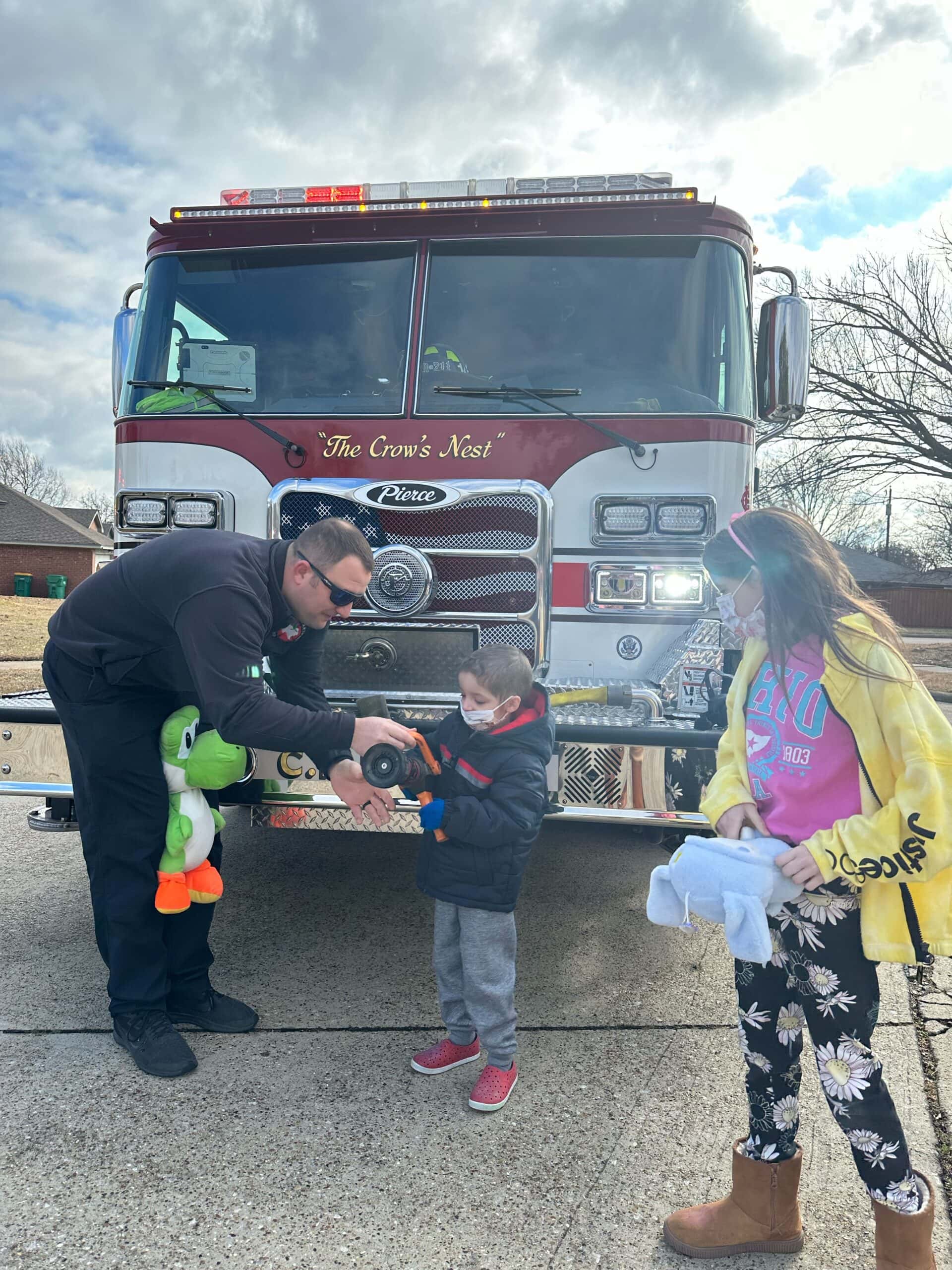 kids by a firetruck