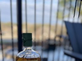 bottle of Buchanans pineapple whiskey and cocktail glass