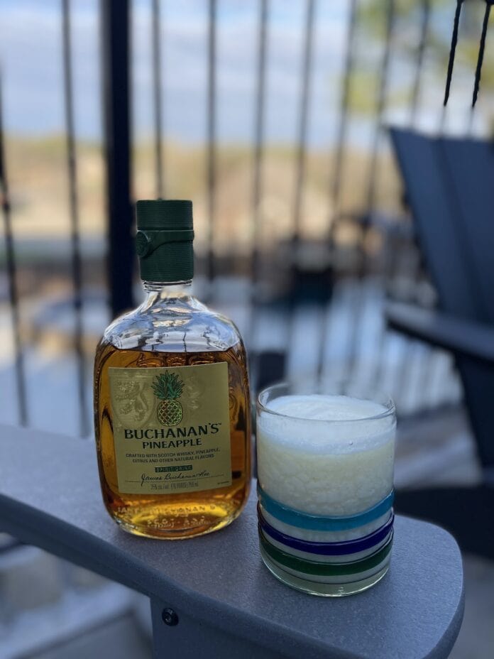 bottle of Buchanans pineapple whiskey and cocktail glass