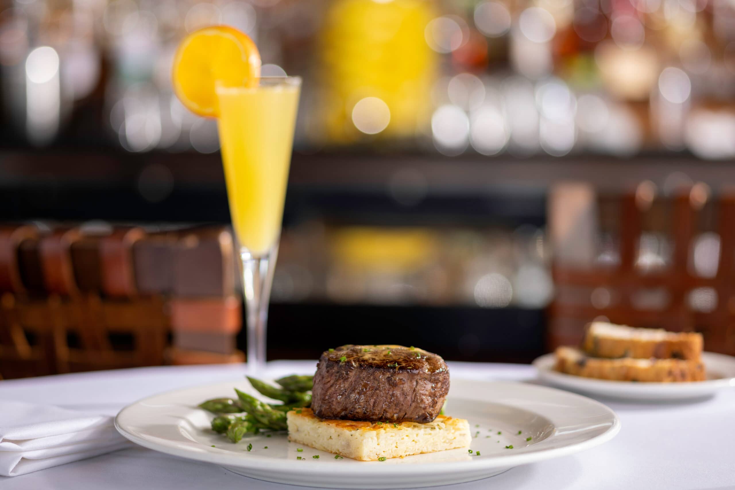filet mignon on plate with mimosa
