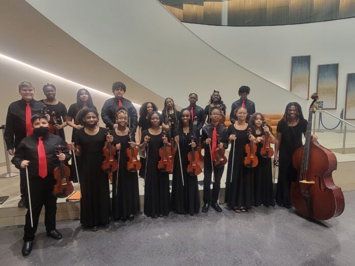 students with orchestra instruments