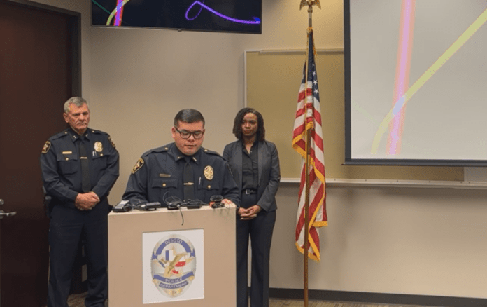 two police officers with DeSoto Mayor