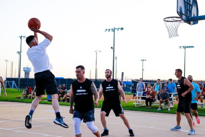 men playing basketball outside